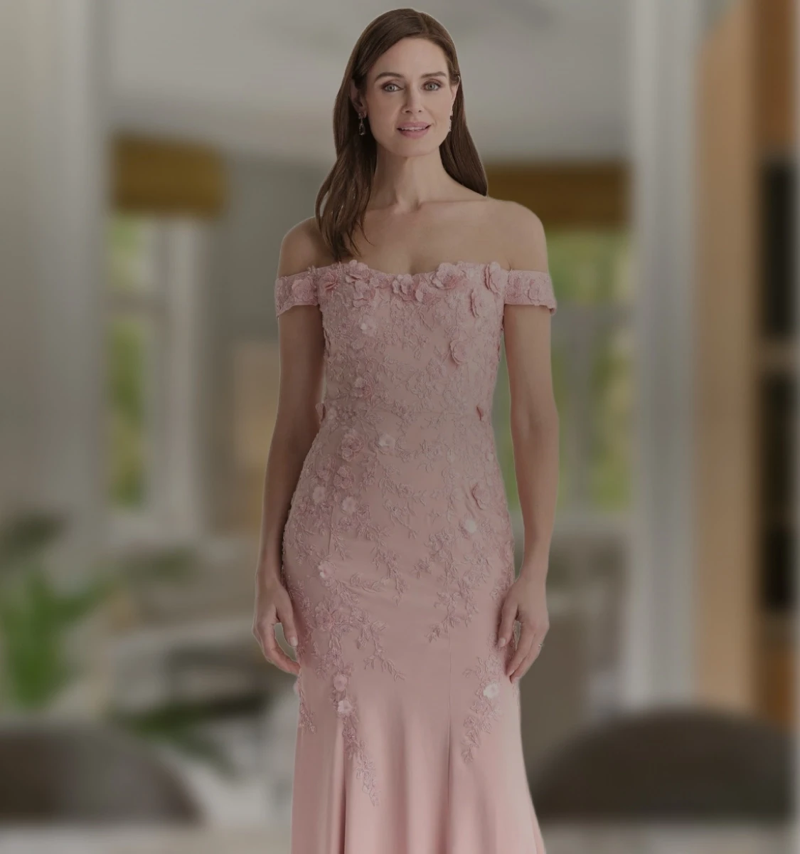 Model wearing a silver gown. Mobile image